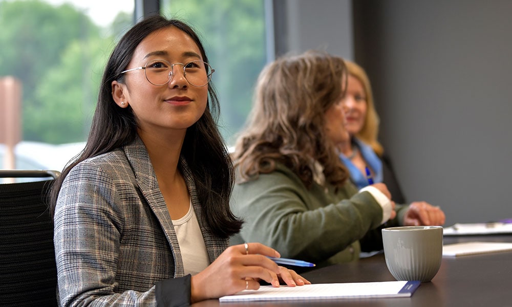 A female Volkart May employee in a meeting