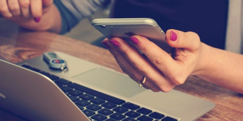 Woman's hand looking at phone